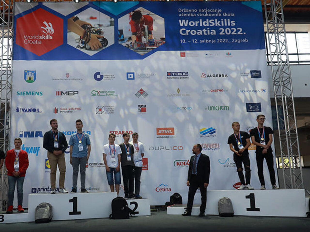 Competitors on a podium receive medals during an award ceremony at the third national competition in Zagreb, Croatia. 
