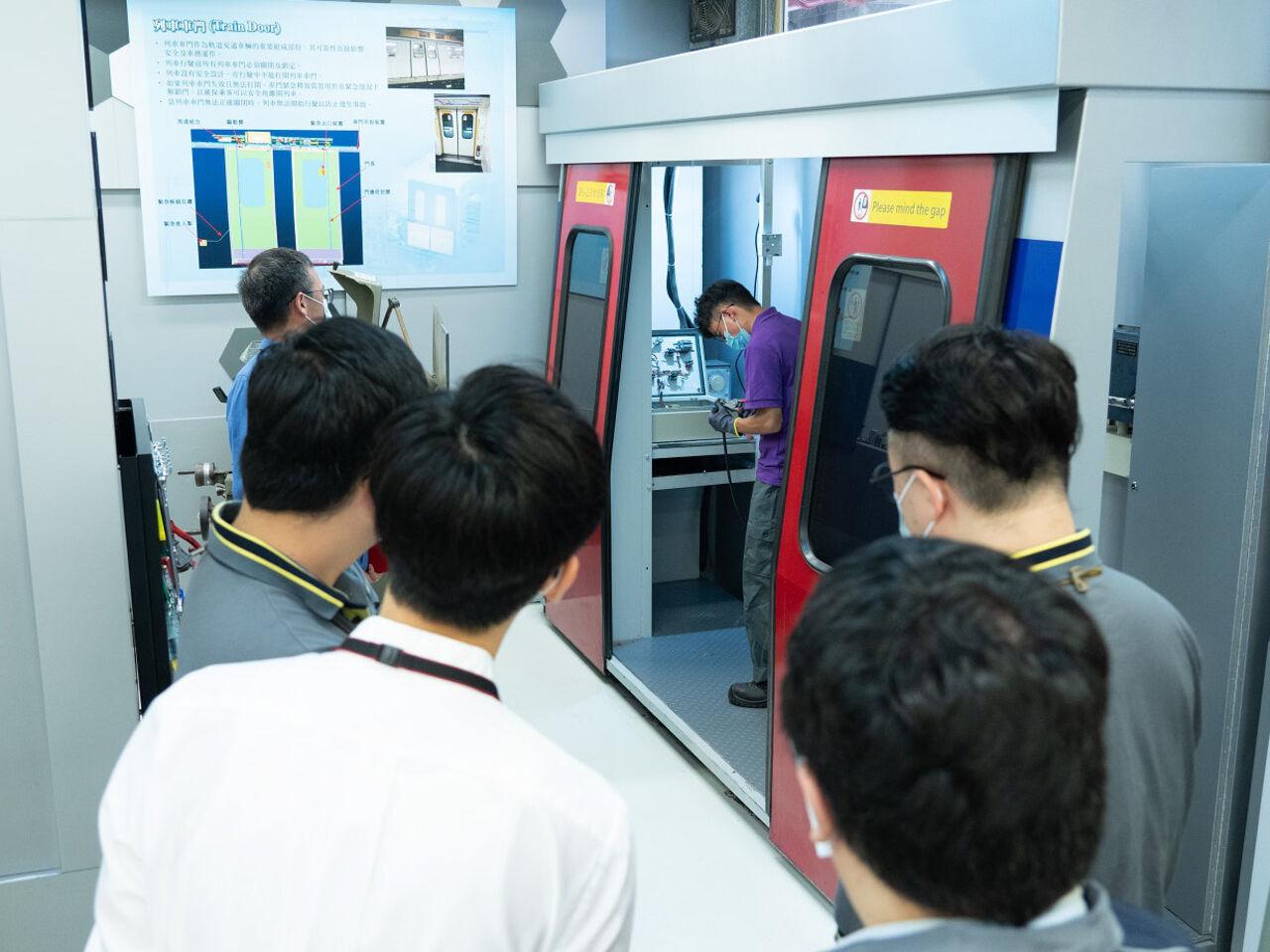 Competitors examine a rail carriage during the final of the Rail Vehicle Technology competition in May 2021.
