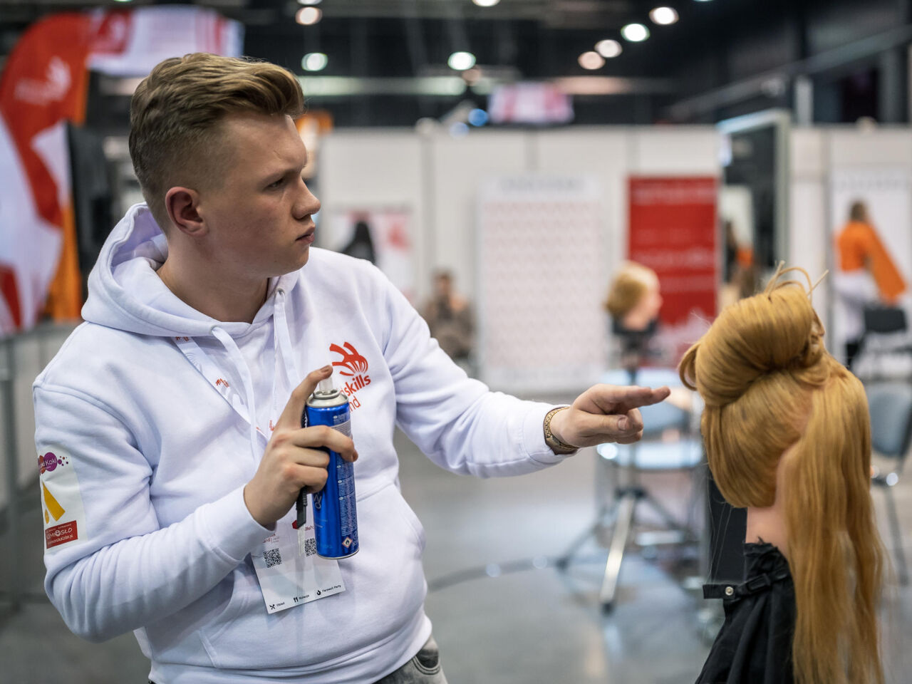 A hairdressing competitor during SkillsPoland in Gdansk, 25-26 November 2021.

Competitors celebrrate after completing SkillsPoland in Gdansk, 25-26 November 2021.
