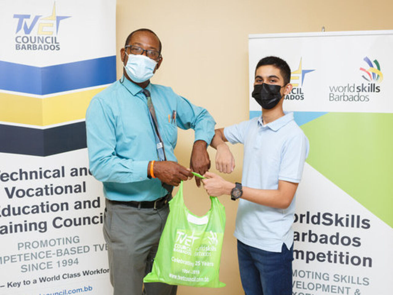 A student receives prizes for successfully completing WorldSkills Barbados Junior Future Skills Camp.
